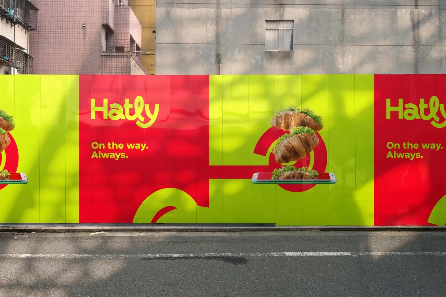 Hatly red and lime street posters with a sandwich above a smartphone