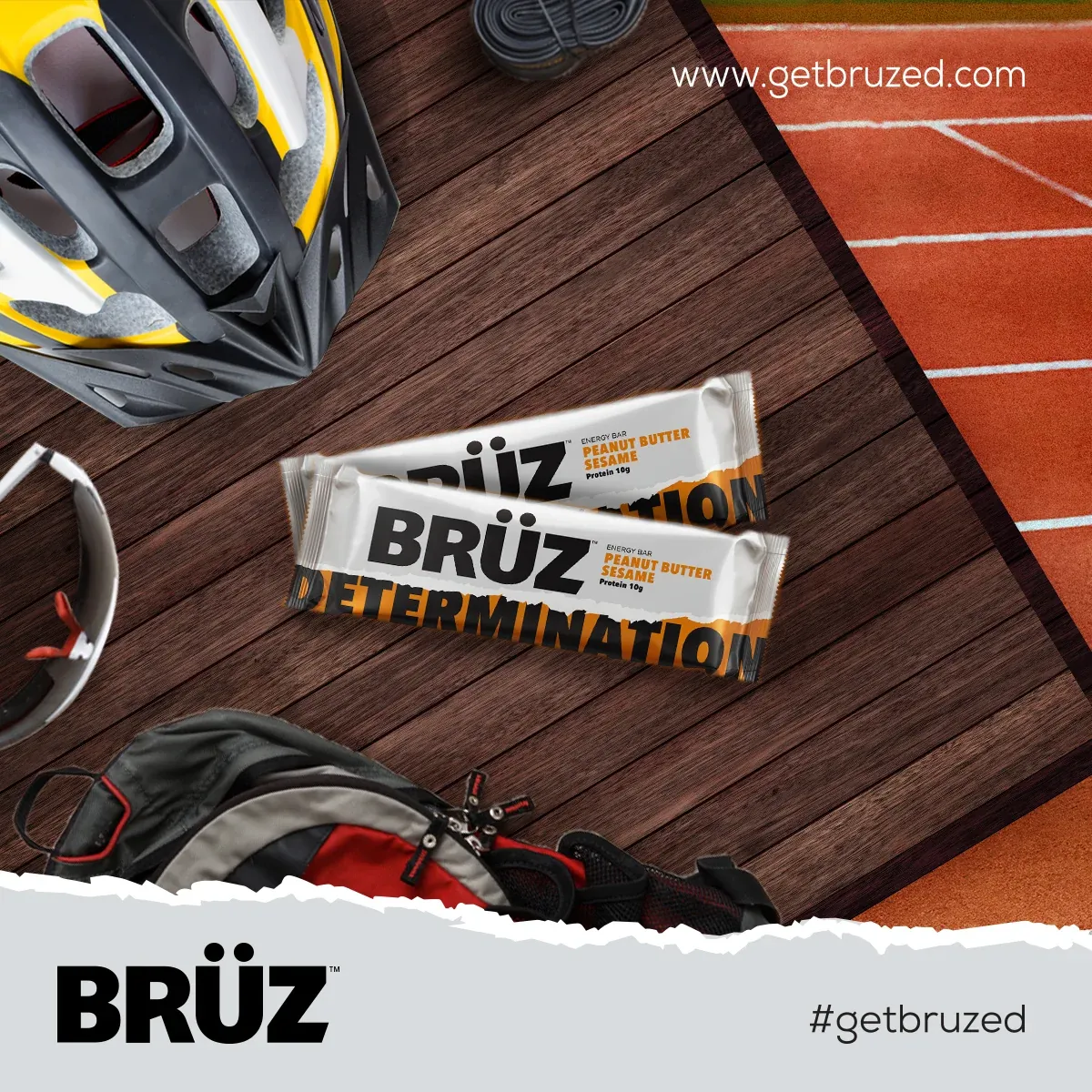 BRÜZ Determination bars on a wooden surface beside sports equipment