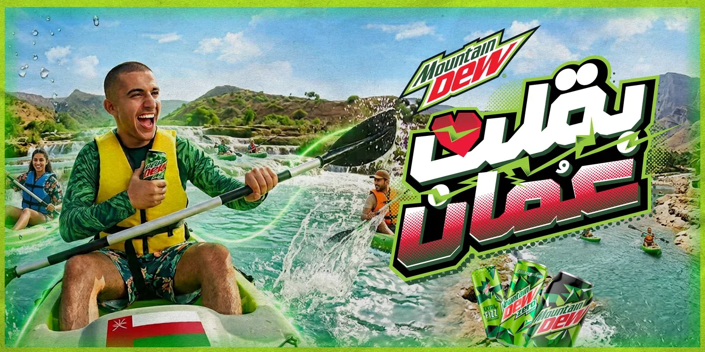 Mountain Dew artwork with a smiling kayaker, splashing water and Arabic campaign lettering