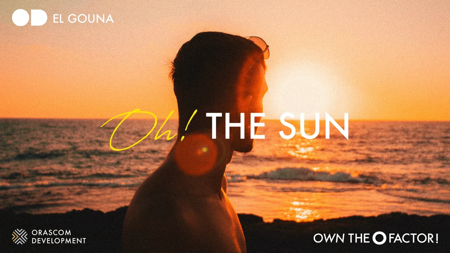 Sun artwork with a silhouetted figure at sunset